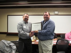 Class members give Matt Hickey an award for blogging. 